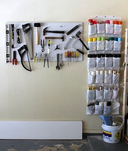 28 Brilliant Garage Organization Ideas | Use a hanging shoe rack in your garage to keep organized.