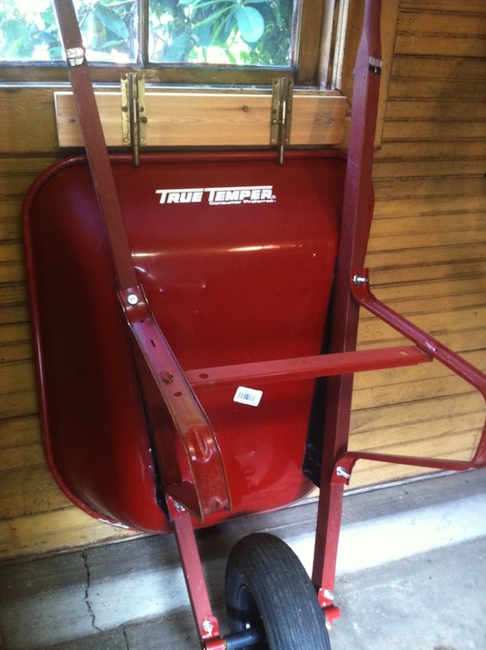 28 Brilliant Garage Organization Ideas | Sliding lock wheelbarrow storage