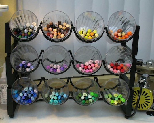 50 Genius Storage Ideas ~ Use stackable wine racks and plastic cups to organize office and craft supplies!
