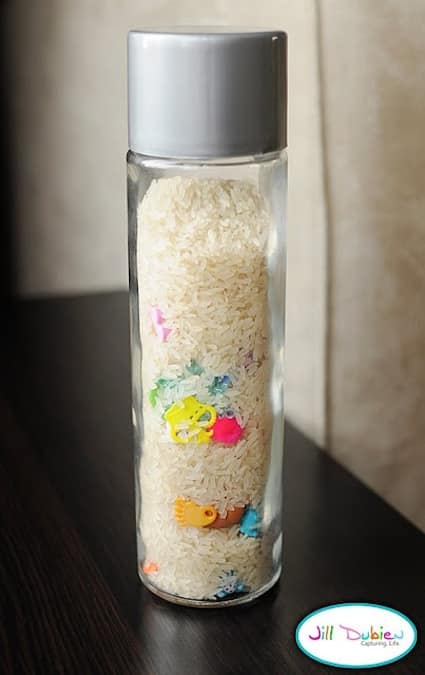 a diy I spy jar with toys and objects hidden in rice for fun crafts adults and kids will enjoy
