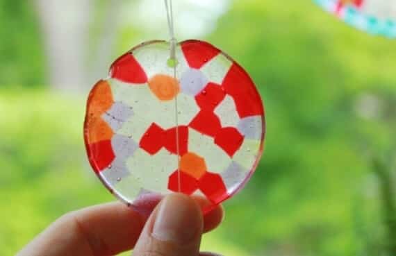 melted plastic beads used to make a window sun-catcher decoration