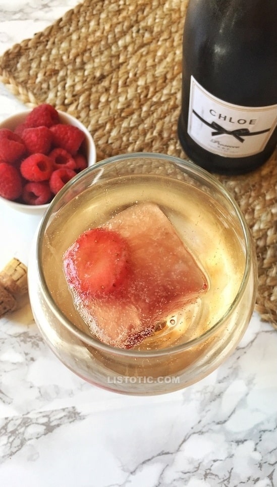 These easy frozen Rosé cubes (also know as Frosé) are a complete game changer! They're the perfect, real simple solution for always having a cold drink recipe in the summer (they're perfect for chilling and flavoring a glass of Prosecco!). | Listotic.com 