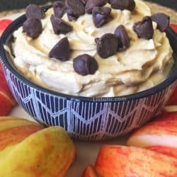 Bowl of easy peanut butter dip with apples.