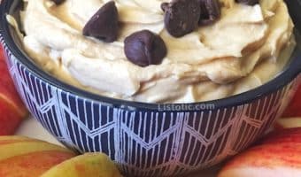 Bowl of easy peanut butter dip with apples.