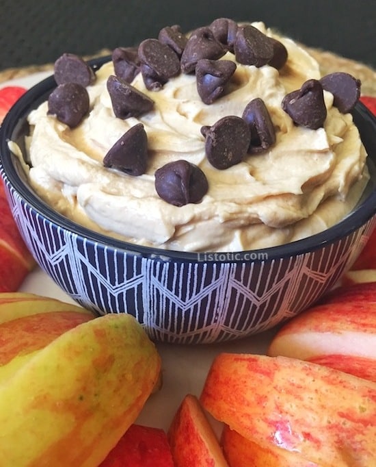 Bowl of easy peanut butter dip with apples.