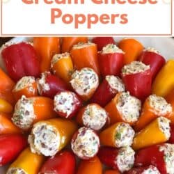 Close-up of sweet pepper poppers stuffed with cream cheese and bacon, served on a white platter as a colorful low carb appetizer.