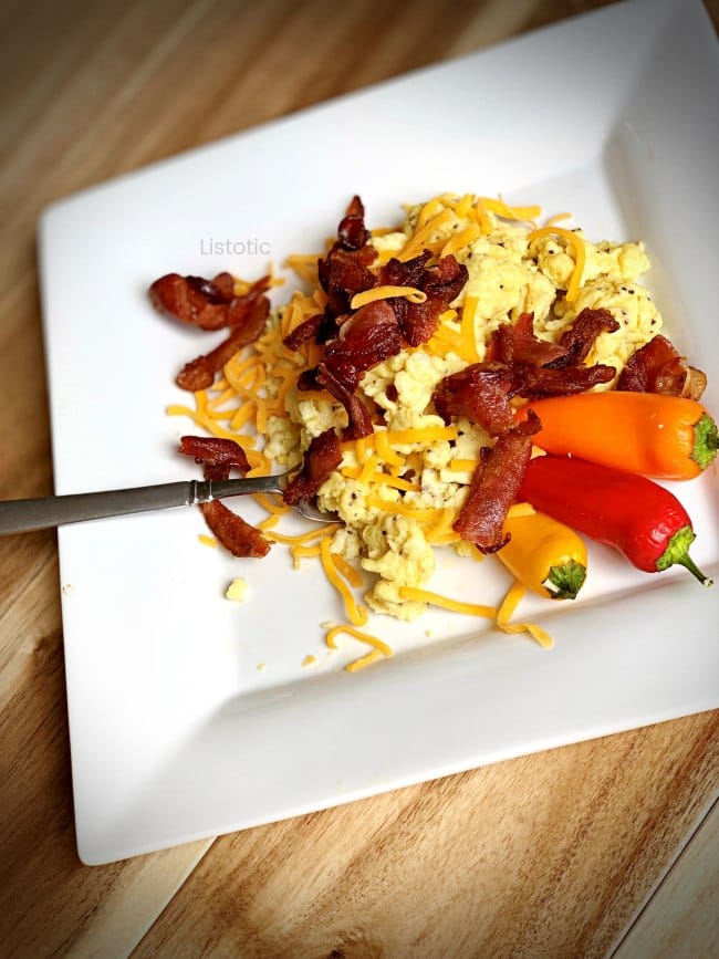 Keto friendly meal with scrambled eggs, bacon and cheese.