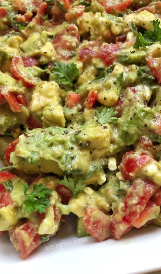 cubed avocado mixed with chopped cherry tomatoes, crumbled feta cheese, minced parsley, vinegar, olive oil, salt, pepper, garlic and onion powder.