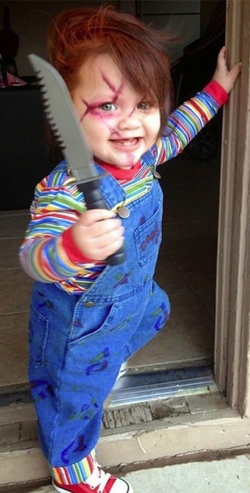 Creepy and scary costume idea for a baby or toddler! Homemade Chucky Costume. Blue bib overalls, striped shirt carrying a plastic knife.