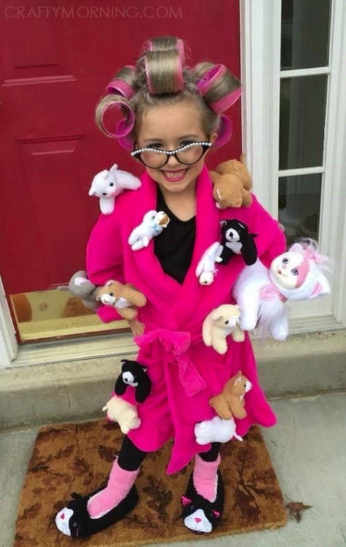 Funny Cat Lady Halloween Costume-- hilarious! Little girl with rollers in her hair, old lady glasses, pink robe and cats attached to the robe. Plus, cat slippers!