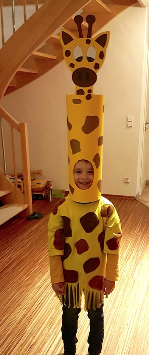 Homemade Giraffe Costume-- super funny! Boy in spotted cape with tall spotted hat and giraffe face attached to the top of the hat.