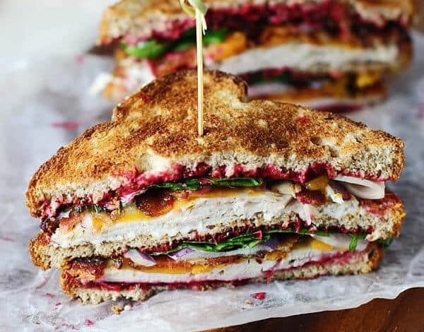 The ultimate leftover turkey club with cranberry mayo and bacon sandwich.