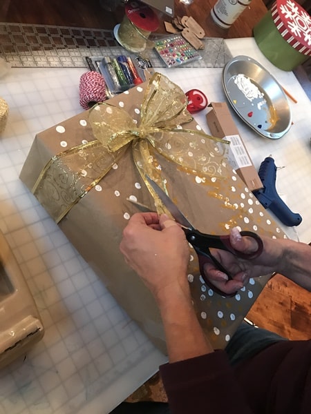 Tie ribbon for finishing touches on package