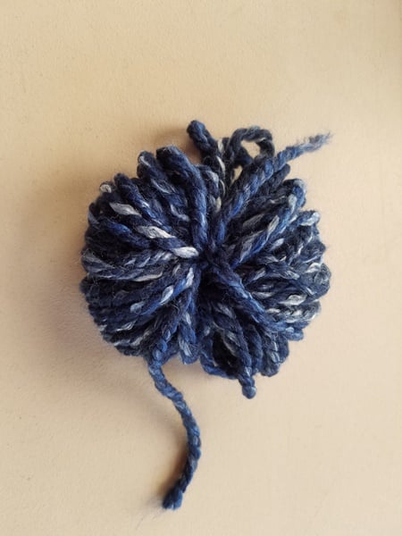 Yarn pom gift topper.