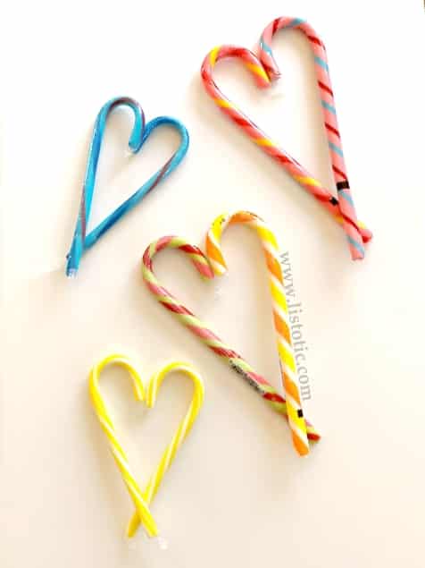 Budget friendly Ideas for kids to DIY candy cane Valentine hearts.