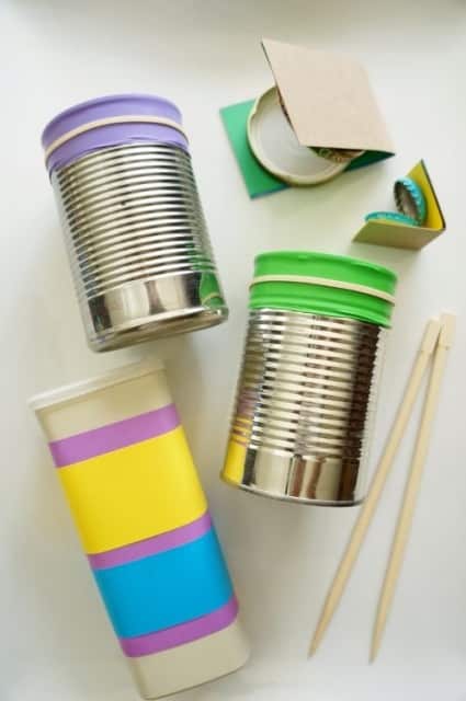 DIY recyclable shaker and castanets made from bottle caps and small food boxes.