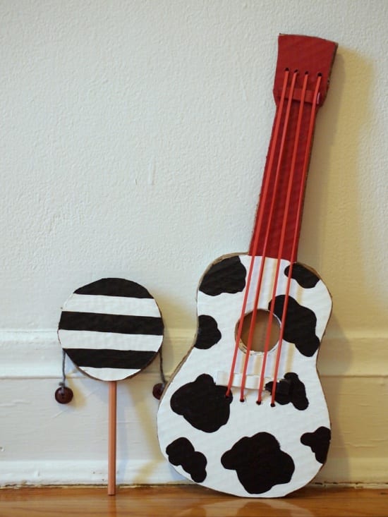 Easy to make DIY instruments for kids including cow print guitar and rattle drum. 