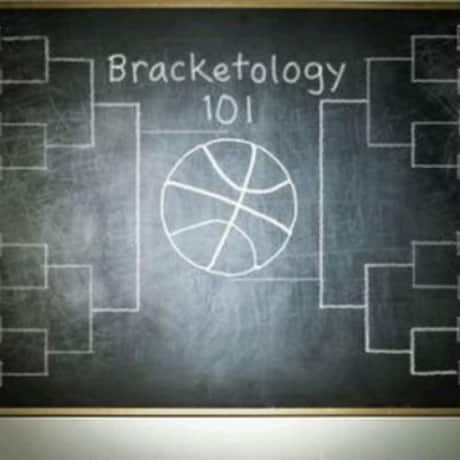 Chalkboard with hand written Bracketology 101 and NCAA College Basketball March madness tournament bracket prediction table. 