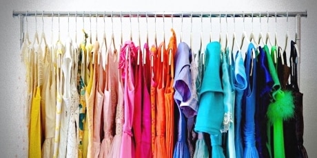 Professional closet organizers recommend creating a decluttered closet organization by color for best closet organization results.