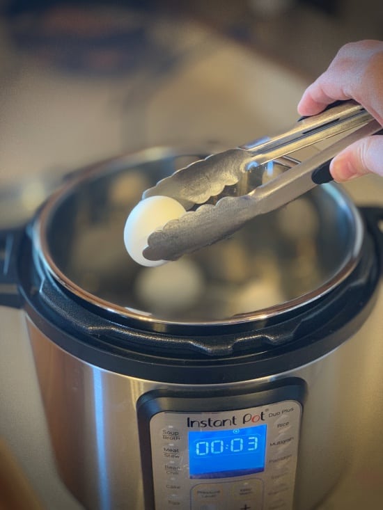 Remove hard boiled eggs form Instant Pot with tongs and add to cold water to peel easy. 