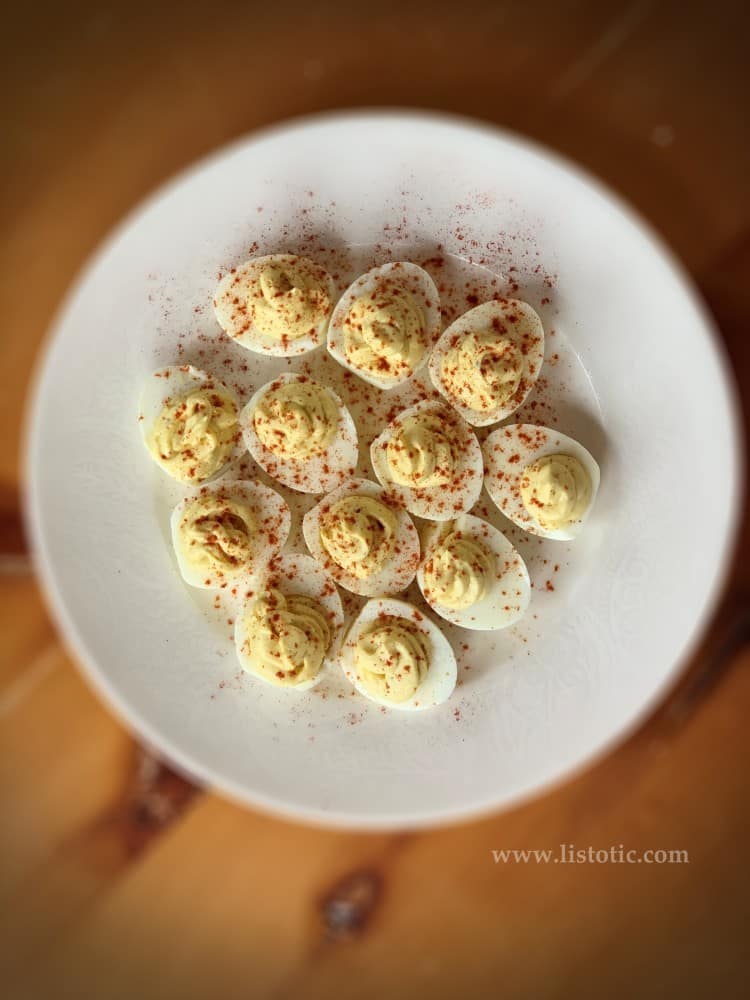 Easter deviled egg platter of classic deviled eggs sprinkled with paprika 