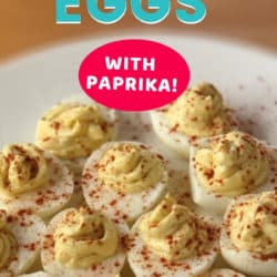 deviled eggs with paprika on a plate