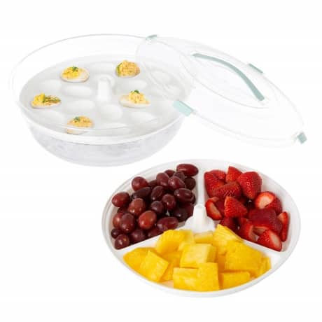 classic deviled eggs over ice in carrier specifically designed for deviled eggs and other fresh relish tray foods on a table for an appetizer at a party or event. 