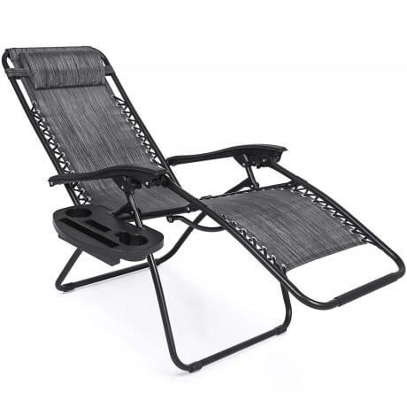 Reclining outdoor lounge chair in black fabric with cup holder, tray and head pillow. 