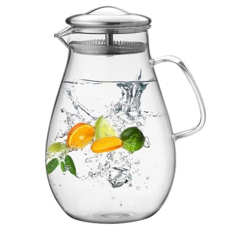 round water pitcher filled with cold water and fresh citrus fruit