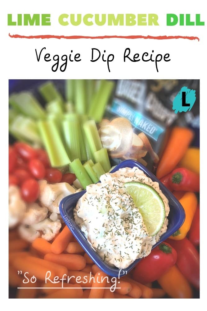 Colorful veggies like peppers, carrots cherry tomatoes, crisp celery sticks and cauliflower surround an appetizer dish of creamy cream cheese, lime and cucumber dill dip. 