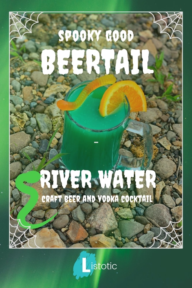 Image of a mug with a beer cocktail inside. Green colored cocktail drink mug resting on river water rocks. 