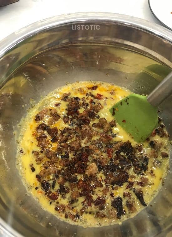 Egg mixture with sausage and sundried tomatoes.
