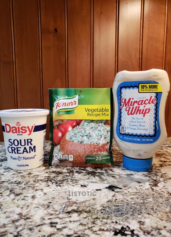 ingredients for Knorr veggie dip: sour cream, Miracle Whip and Knorr Veggie Recipe mix.