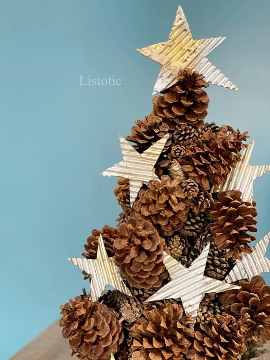 Pine cone tree craft sitting on a table