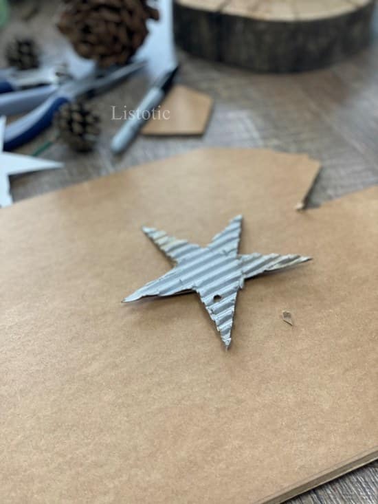 large piece of cardboard with star shape cut 