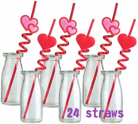 six milk glasses with twisty fun shaped valentine’s day straws 