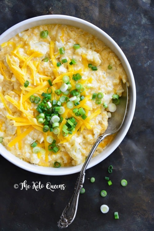 Keto Macaroni and Cheese in a white bowl garnished with scallions.