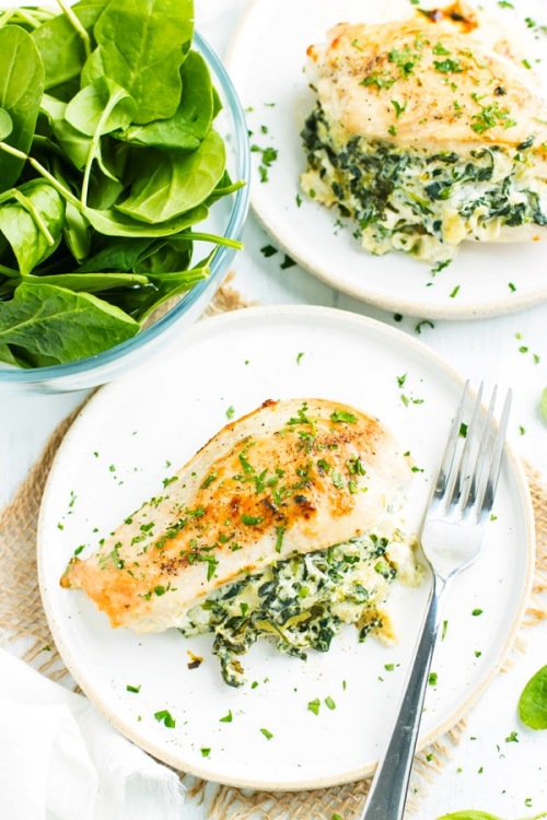 Keto-friendly creamy spinach artichoke dip stuffed chicken breast meal.