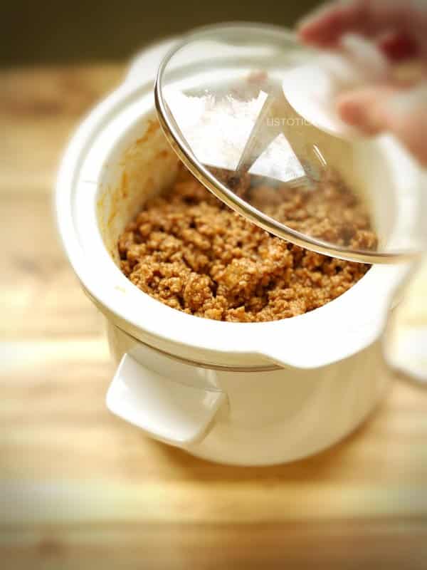 crockpot filled with ground beef tavern sandwich meat for sandwiches