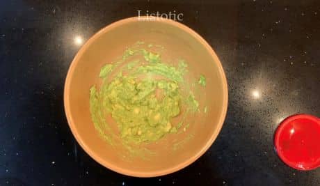 A bowl full of mushed avocado.