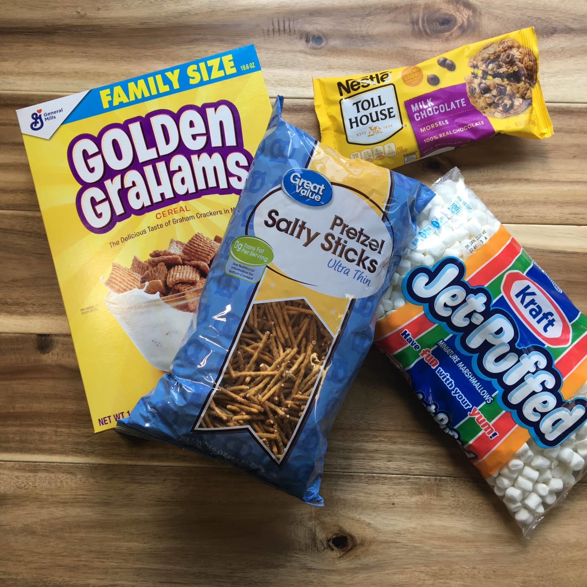 4 ingredient smore snack mix with golden grahams, pretzel, marshmallows and chocolate chips.