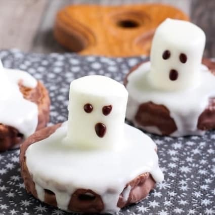 Chocolate Ghost Cookies that are easy to make with marshmallows and melted frosting
