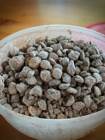 Big bowl of microwave Crispix Puppy Chow peanut butter snack mix 