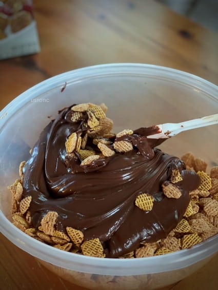 Microwave Puppy chow recipe being made with Melted chocolate and peanut butter 