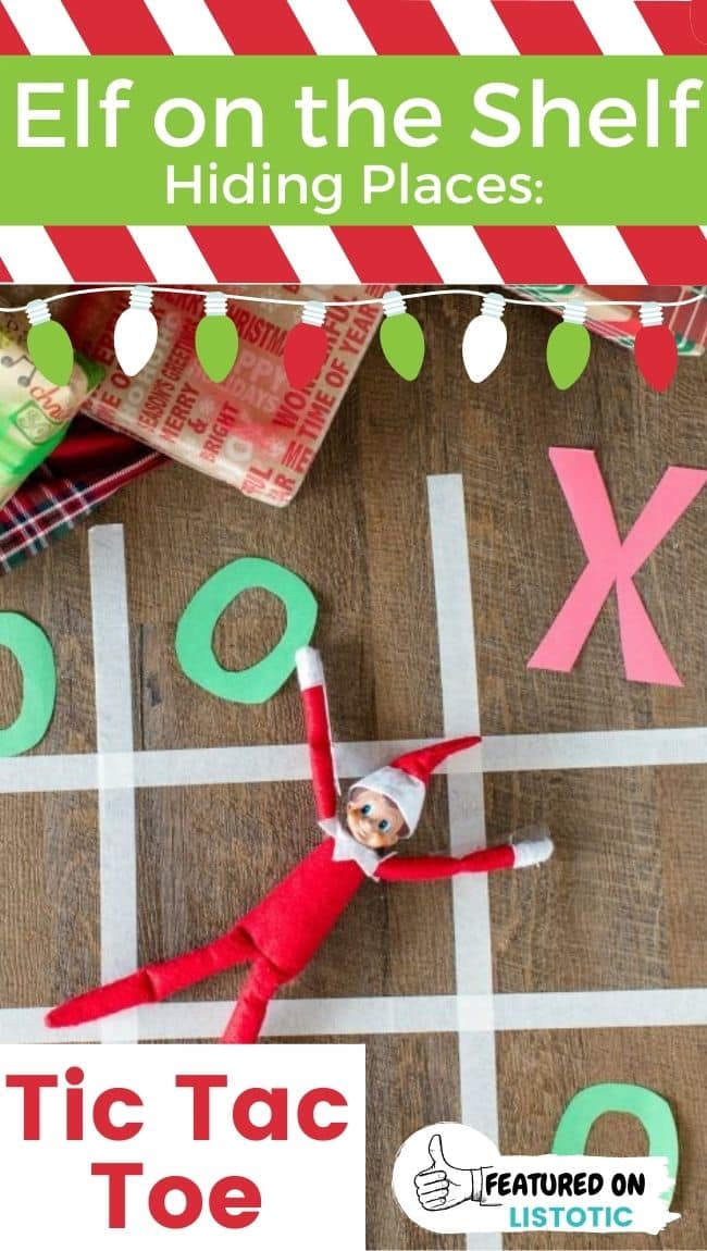 An Elf on the Shelf doll posing as an "X" in a game of tic tac toe.