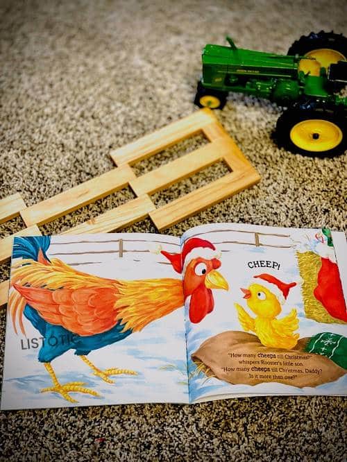 kinderen die prentenboek tellen op het tapijt naast boerderijspeelgoed een geweldig boek voor hardop voorlezen van Kerstverhalen