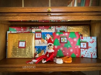 Elf on the shelf arrival ideas like a book advent calendar with the Elf himself and wrapped picture books for kids