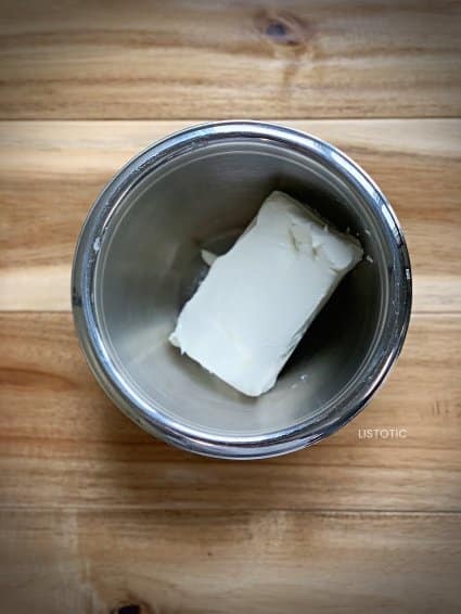 block of cream cheese in a bowl to make cream cheese apple dip