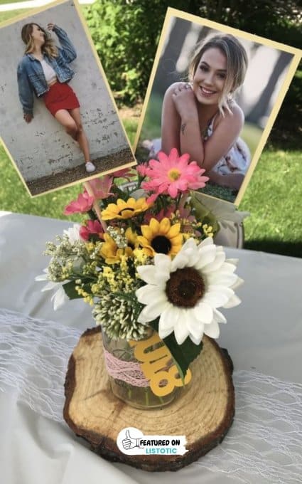 rustic photo display on slab of wood with mason jar