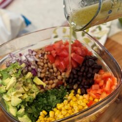 cowboy caviar dressing mixture added to chopped up ingredients